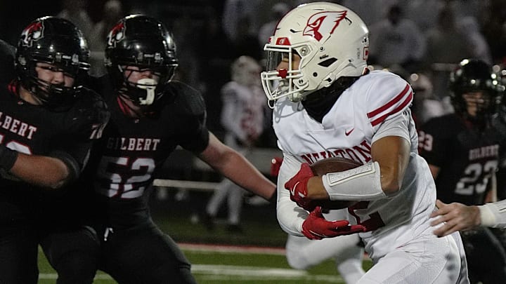 Newton Cardinals running backdefensive back Isaiah Hansen (2) runs for a touchdown against Gilbert during the second quarter in the high school football class 4A quarterfinal on Nov. 7, 2025, at Tigers Stadium, Gilbert, Iowa. Newton Cardinals running backdefensive back Isaiah Hansen (2) runs for a touchdown against Gilbert during the second quarter in the high school football class 4A quarterfinal on Nov. 7, 2025, at Tigers Stadium, Gilbert, Iowa.