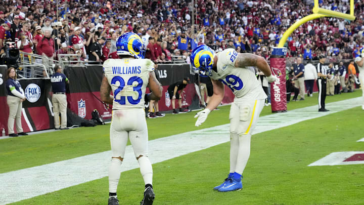Los Angeles Rams tight end Tyler Higbee (89) reacts after a touchdown by running back Kyren Williams (23) against the Arizona Cardinals in the second half at State Farm Stadium in Glendale on Nov. 26, 2023.