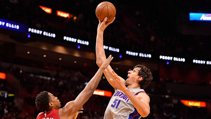 Jan 3, 2018; Miami, FL, USA; Detroit Pistons center Boban Marjanovic (51) shoots the ball over Miami Heat center Hassan Whiteside (21) during the first half at American Airlines Arena. Mandatory Credit: Jasen Vinlove-Imagn Images