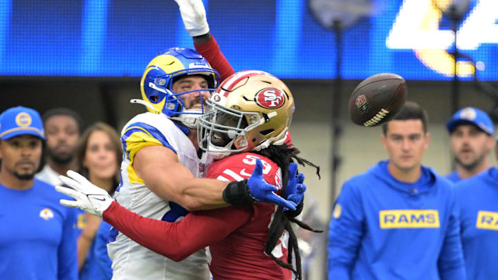 Sep 22, 2024; Inglewood, California, USA;  San Francisco 49ers linebacker De'Vondre Campbell (59) fouls Los Angeles Rams tight end Tyler Higbee (89) in the fourth quarter at SoFi Stadium. Mandatory Credit: Jayne Kamin-Oncea-Imagn Images