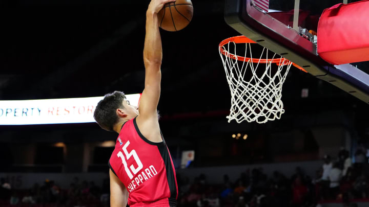 Jul 14, 2024; Las Vegas, NV, USA; Houston Rockets guard Reed Sheppard (15) dunks against the Washington Wizards during the third quarter at Thomas & Mack Center. Mandatory Credit: Stephen R. Sylvanie-USA TODAY Sports