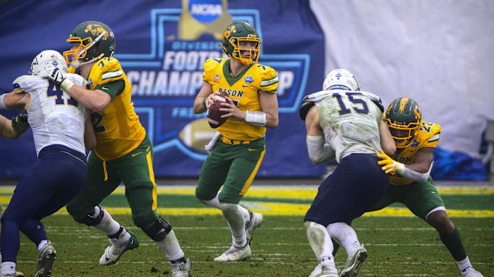 Jan 8, 2022; Frisco, TX, USA; North Dakota State Bison quarterback Cam Miller (7) drops back to pass against the Montana State Bobcats during the FCS Championship between the North Dakota State Bison and the Montana State Bobcats at Toyota Stadium. Mandatory Credit: Jerome Miron-Imagn Images