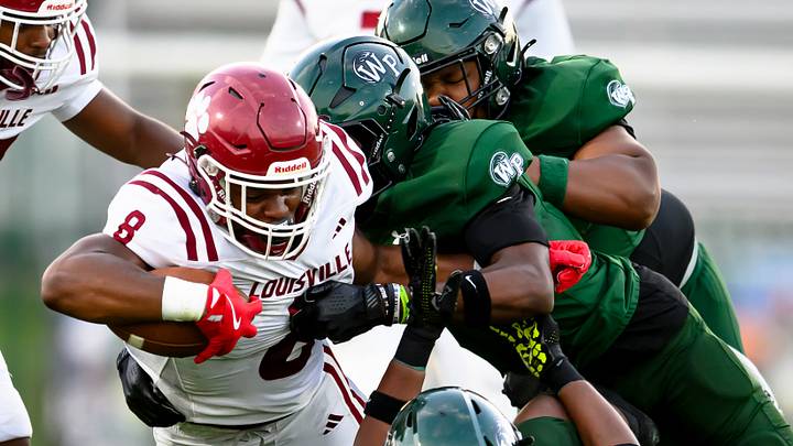 Zaiden Jernigan (8) fights for extra yards in Louisville's 21-6 win over the West Point Green Wave. Zaiden Jernigan (8) fights for extra yards in Louisville's 21-6 win over the West Point Green Wave.