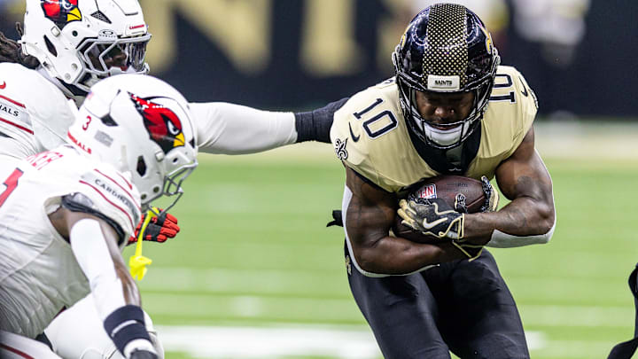 Sep 7, 2025; New Orleans, Louisiana, USA; New Orleans Saints wide receiver Brandin Cooks (10) is tackled by the Arizona Cardinals during the second half at Caesars Superdome. 
