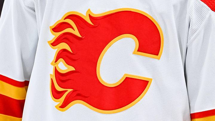 Dec 12, 2022; Montreal, Quebec, CAN; View of a Calgary Flames logo on a jersey worn by the member of the team during the second period at Bell Centre. Mandatory Credit: David Kirouac-Imagn Images