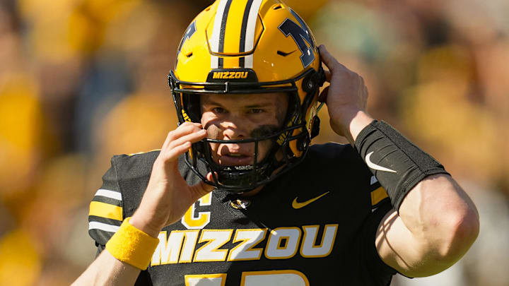 Oct 19, 2024; Columbia, Missouri, USA; Missouri Tigers quarterback Brady Cook (12) returns to the game during the second half against the Auburn Tigers at Faurot Field at Memorial Stadium. Mandatory Credit: Jay Biggerstaff-Imagn Images Oct 19, 2024; Columbia, Missouri, USA; Missouri Tigers quarterback Brady Cook (12) returns to the game during the second half against the Auburn Tigers at Faurot Field at Memorial Stadium. Mandatory Credit: Jay Biggerstaff-Imagn Images