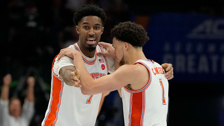 Mar 13, 2025; Charlotte, NC, USA; Clemson Tigers forward Chauncey Wiggins (7) and guard Chase Hunter (1) react in the second half at Spectrum Center. Mandatory Credit: Bob Donnan-Imagn Images