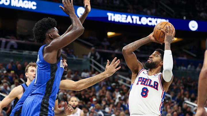 Philadelphia 76ers forward Paul George (8) shoots the ball against the Orlando Magic in the second quarter at Kia Center.