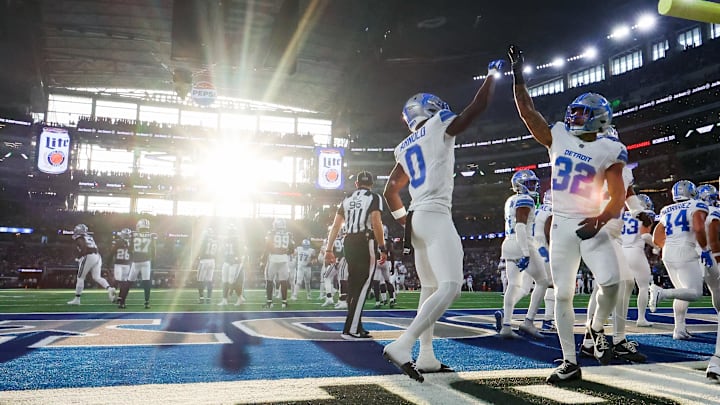 Detroit Lions safety Brian Branch celebrates with Detroit Lions cornerback Terrion Arnold after making an interception against the Dallas Cowboys at AT&T Stadium. Detroit Lions safety Brian Branch celebrates with Detroit Lions cornerback Terrion Arnold after making an interception against the Dallas Cowboys at AT&T Stadium.