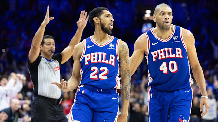 Apr 17, 2024; Philadelphia, Pennsylvania, USA; Philadelphia 76ers guard Cameron Payne (22) reacts next to forward Nicolas Batum (40) after his three pointer against the Miami Heat during the third quarter of a play-in game of the 2024 NBA playoffs at Wells Fargo Center. Mandatory Credit: Bill Streicher-Imagn Images