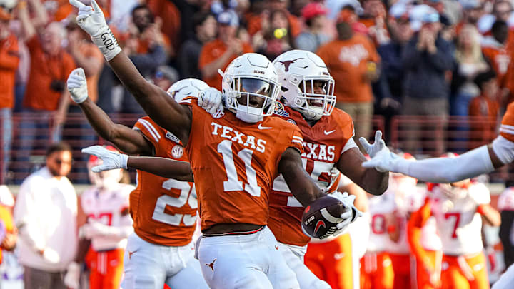 Texas Longhorns edge rusher Colin Simmons (11) celebrates an interception during the game against Clemson in the first round of the College Football Playoffs at Darrell K Royal-Texas Memorial Stadium on Saturday, Dec. 21, 2024. Texas Longhorns edge rusher Colin Simmons (11) celebrates an interception during the game against Clemson in the first round of the College Football Playoffs at Darrell K Royal-Texas Memorial Stadium on Saturday, Dec. 21, 2024.