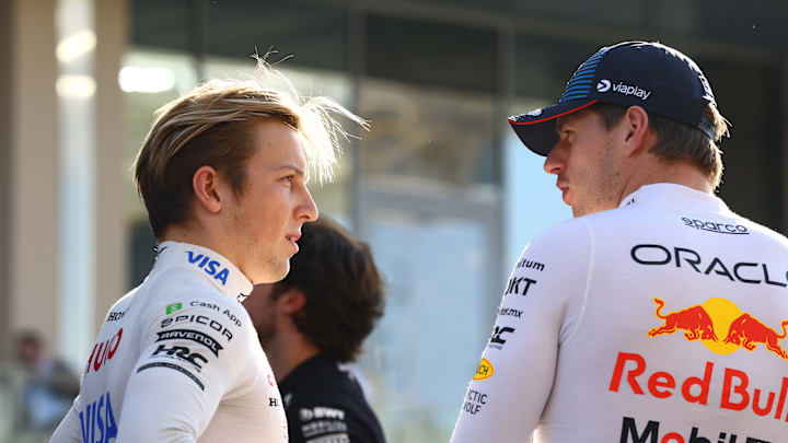 ABU DHABI, UNITED ARAB EMIRATES - DECEMBER 08: Liam Lawson of New Zealand and Visa Cash App RB talks to Max Verstappen of the Netherlands and Oracle Red Bull Racing prior to the F1 Grand Prix of Abu Dhabi at Yas Marina Circuit on December 08, 2024 in Abu Dhabi, United Arab Emirates. (Photo by Mark Thompson/Getty Images)
