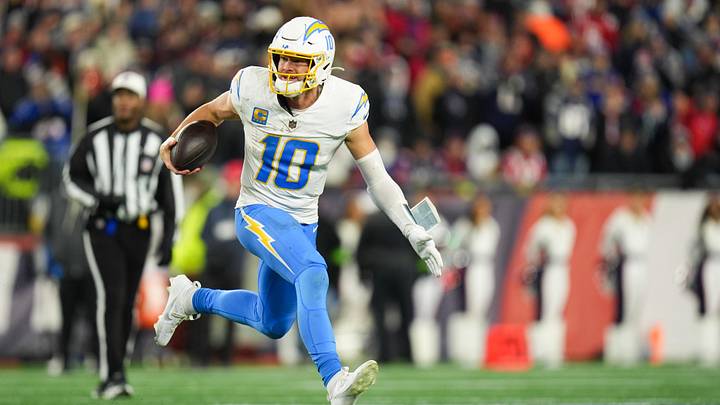 Jan 11, 2026; Foxborough, MA, USA; Los Angeles Chargers quarterback Justin Herbert (10) scrambles during the fourth quarter against the New England Patriots in an AFC Wild Card Round game at Gillette Stadium. Mandatory Credit: David Butler II-Imagn Images Jan 11, 2026; Foxborough, MA, USA; Los Angeles Chargers quarterback Justin Herbert (10) scrambles during the fourth quarter against the New England Patriots in an AFC Wild Card Round game at Gillette Stadium. Mandatory Credit: David Butler II-Imagn Images