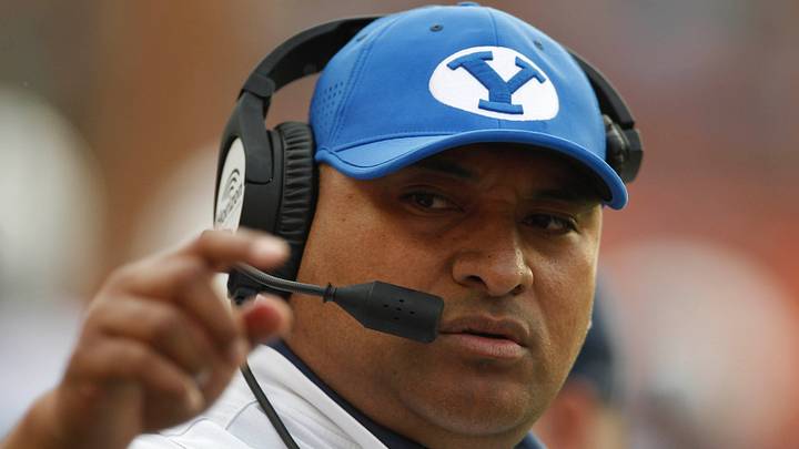 Nov 25, 2017; Honolulu, HI, USA; Brigham Young Cougars head coach Kalani Sitake watches game action during the first quarter of an NCAA college football game against the Hawaii Warriors at Aloha Stadium. Mandatory Credit: Marco Garcia-USA TODAY Sports Nov 25, 2017; Honolulu, HI, USA; Brigham Young Cougars head coach Kalani Sitake watches game action during the first quarter of an NCAA college football game against the Hawaii Warriors at Aloha Stadium. Mandatory Credit: Marco Garcia-USA TODAY Sports