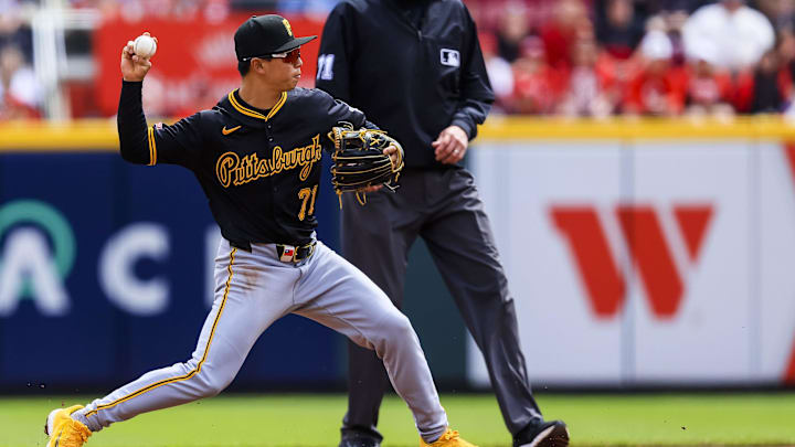 Apr 13, 2025; Cincinnati, Ohio, USA; Pittsburgh Pirates shortstop Tsung-Che Cheng (71) throws to first to get Cincinnati Reds outfielder Gavin Lux (not pictured) out in the third inning at Great American Ball Park. Mandatory Credit: Katie Stratman-Imagn Images