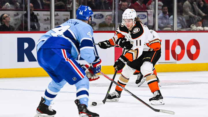Dec 15, 2022; Montreal, Quebec, CAN; Anaheim Ducks center Trevor Zegras (11) plays the puck against