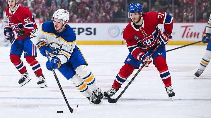 May 16, 2026; Montreal, Quebec, CAN; Buffalo Sabres left wing Zach Benson (6) plays the puck against Montreal Canadiens center Jake Evans (71) during the second period in game six of the second round of the 2026 Stanley Cup Playoffs at Bell Centre. Mandatory Credit: David Kirouac-Imagn Images