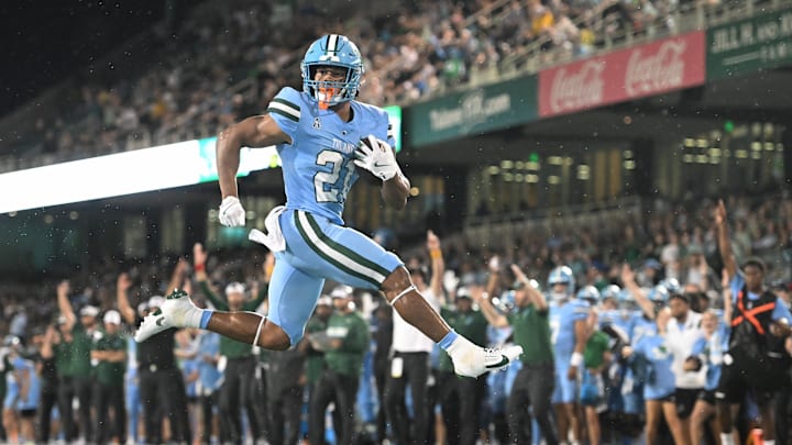 Tulane Green Wave running back Mekhi Hughes (21) runs with the ball.