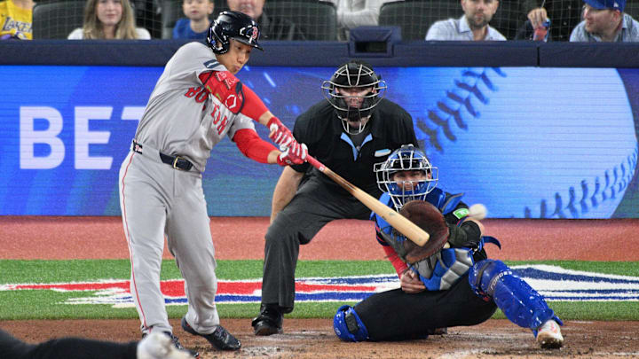 Sep 25, 2024; Toronto, Ontario, CAN; Boston Red Sox designated hitter Masataka Yoshida (7) hits a double against the Toronto Blue Jays in the fourth inning at Rogers Centre. Mandatory Credit: Dan Hamilton-Imagn Images Sep 25, 2024; Toronto, Ontario, CAN; Boston Red Sox designated hitter Masataka Yoshida (7) hits a double against the Toronto Blue Jays in the fourth inning at Rogers Centre. Mandatory Credit: Dan Hamilton-Imagn Images