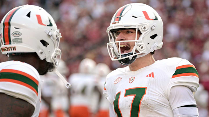 Nov 11, 2023; Tallahassee, Florida, USA; Miami Hurricanes quarterback Emory Williams (17) celebrates a touchdown pass against the Florida State Seminoles during the second half at Doak S. Campbell Stadium. Mandatory Credit: Melina Myers-Imagn Images