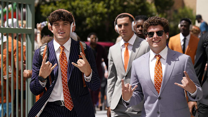 Sep 2, 2023; Austin, Texas, USA; Texas Longhorns punter Ian Ratliff (left) and kicker Will Stone (right) hold up their horns when arriving at Darrell K Royal-Texas Memorial Stadium before a game against the Rice Owls. Mandatory Credit: Scott Wachter-Imagn Images