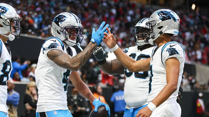 Carolina Panthers quarterback Bryce Young (9) shakes hands with wide receiver Tetairoa McMillan (4) after a touchdown Carolina Panthers quarterback Bryce Young (9) shakes hands with wide receiver Tetairoa McMillan (4) after a touchdown
