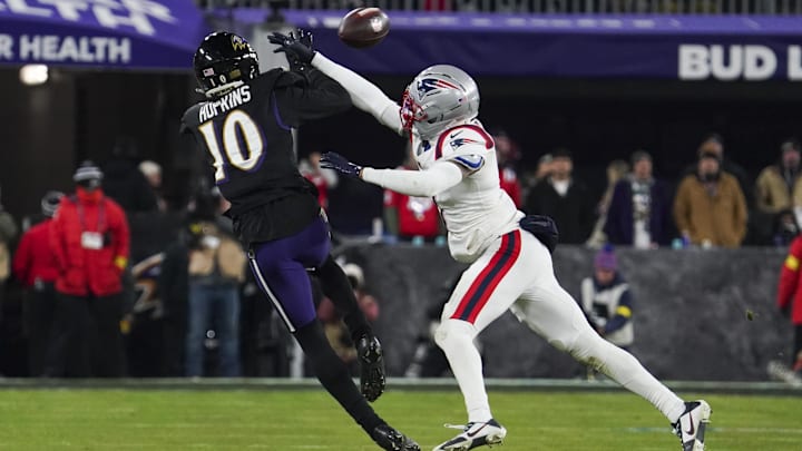 Dec 21, 2025; Baltimore, Maryland, USA;  Baltimore Ravens wide receiver Deandre Hopkins (10) makes a catch against New England Patriots cornerback Carlton Davis III (7) during the second half of the game at M&T Bank Stadium. Mandatory Credit: James Lang-Imagn Images