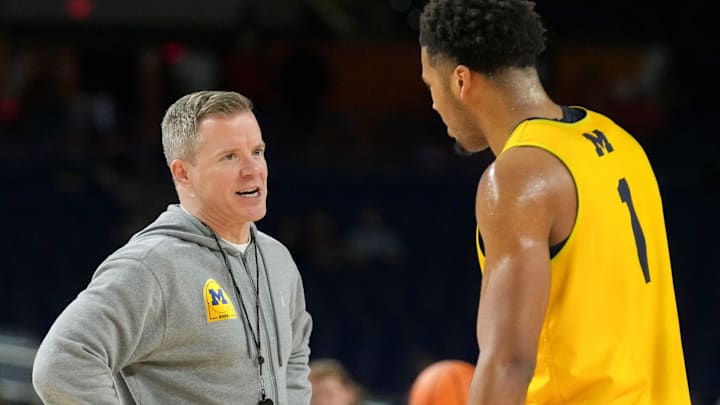 Michigan Wolverines head coach Dusty May speaks with guard Trey McKenney (1) during practice ahead of a Final Four game on Friday, April 3, 2026, at Lucas Oil Stadium in Indianapolis.