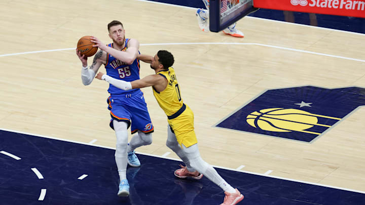 Jun 19, 2025; Indianapolis, Indiana, USA; Indiana Pacers guard Tyrese Haliburton (0) defends against Oklahoma City Thunder center Isaiah Hartenstein (55) in the third quarter during game six of the 2025 NBA Finals at Gainbridge Fieldhouse. Mandatory Credit: Trevor Ruszkowski-Imagn Images