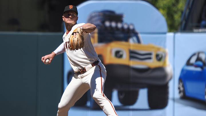 Jun 10, 2026; San Francisco, California, USA; San Francisco Giants third baseman Matt Chapman (26) throws the ball to first base against the Washington Nationals during the eighth inning at Oracle Park. Mandatory Credit: Kelley L Cox-Imagn Images