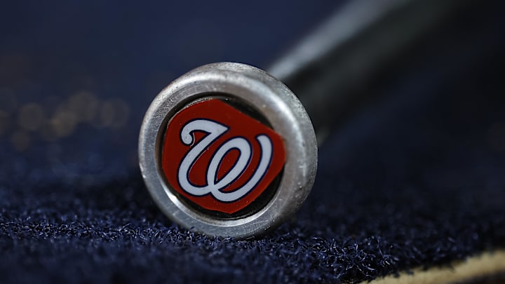 May 12, 2023; Washington, District of Columbia, USA; A detailed view of the Washington Nationals logo on a weighted bat during the seventh inning of the game between the Washington Nationals and the New York Mets at Nationals Park. May 12, 2023; Washington, District of Columbia, USA; A detailed view of the Washington Nationals logo on a weighted bat during the seventh inning of the game between the Washington Nationals and the New York Mets at Nationals Park.