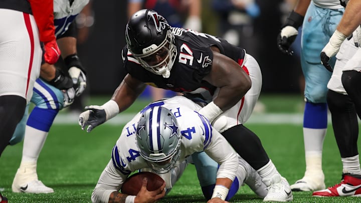 Nov 3, 2024; Atlanta, Georgia, USA; Atlanta Falcons defensive end Grady Jarrett (97) sacks Dallas Cowboys quarterback Dak Prescott (4) in the first quarter at Mercedes-Benz Stadium. Mandatory Credit: Brett Davis-Imagn Images