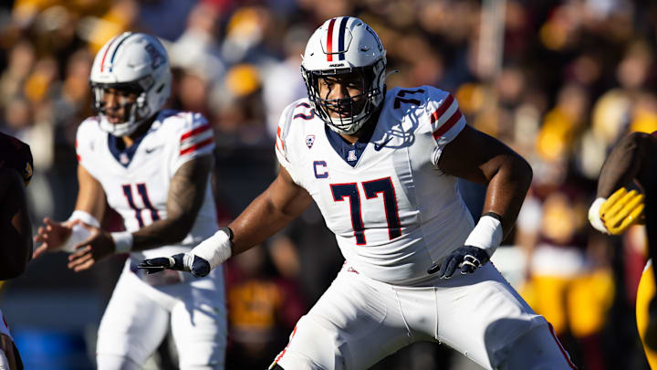 Nov 25, 2023; Tempe, Arizona, USA; Arizona Wildcats offensive lineman Jordan Morgan (77) against the Nov 25, 2023; Tempe, Arizona, USA; Arizona Wildcats offensive lineman Jordan Morgan (77) against the