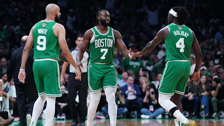 Oct 22, 2024; Boston, Massachusetts, USA; Boston Celtics guard Jaylen Brown (7), guard Jrue Holiday (4) and guard Derrick White (9) react after a play against the New York Knicks in the second half at TD Garden. Mandatory Credit: David Butler II-Imagn Images Oct 22, 2024; Boston, Massachusetts, USA; Boston Celtics guard Jaylen Brown (7), guard Jrue Holiday (4) and guard Derrick White (9) react after a play against the New York Knicks in the second half at TD Garden. Mandatory Credit: David Butler II-Imagn Images