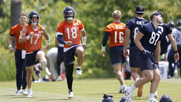Caleb Williams during warmups at OTAs. The Bears won't have him at any rookie work this week until he signs a contract.