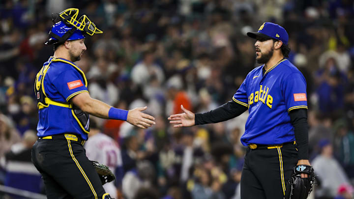 Apr 10, 2026; Seattle, Washington, USA; Seattle Mariners pitcher Andres Munoz (75) celebrates with catcher Cal Raleigh (29, left) following a victory against the Houston Astros  at T-Mobile Park. Mandatory Credit: Joe Nicholson-Imagn Images