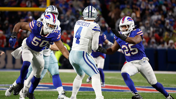 Buffalo Bills defensive end Greg Rousseau (50) and Buffalo Bills linebacker Tyrel Dodson (25) come