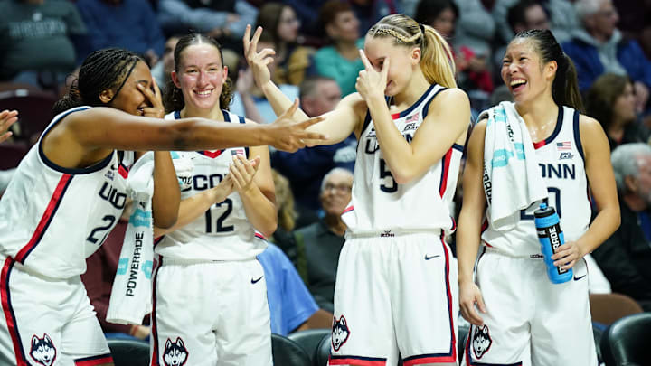 UConn Huskies forward Sarah Strong, guard Ashlynn Shade, guard Paige Bueckers, and guard Kaitlyn Chen react after a three-pointer against Iowa State.