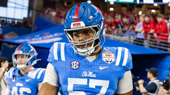Jan 8, 2026; Glendale, AZ, USA; Mississippi Rebels offensive lineman TJ Hedrick (57) against the Miami Hurricanes during the 2026 Fiesta Bowl and semifinal game of the College Football Playoff at State Farm Stadium. Mandatory Credit: Mark J. Rebilas-Imagn Images