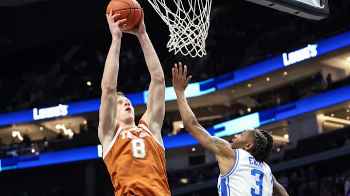 Nov 4, 2025; Charlotte, North Carolina, USA; Texas Longhorns center Matas Vokietaitis (8) goes to the basket against the Duke Blue Devils during the second half of the Dick Vitale’s Invitational game at Spectrum Center. Mandatory Credit: Cory Knowlton-Imagn Images