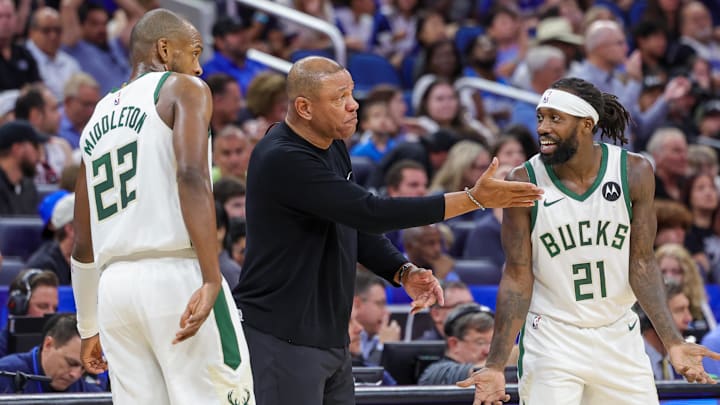 Apr 14, 2024; Orlando, Florida, USA; Milwaukee Bucks head coach Doc Rivers talks with Milwaukee Bucks guard Patrick Beverley (21) and forward Khris Middleton (22) during the second quarter against the Orlando Magic at KIA Center. Mandatory Credit: Mike Watters-Imagn Images