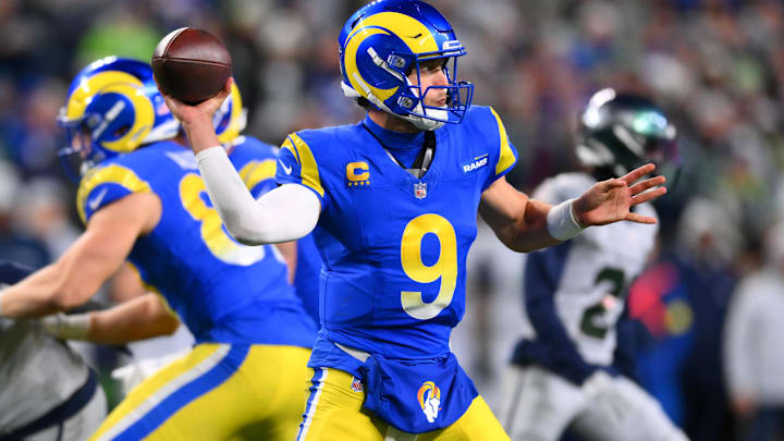 Dec 18, 2025; Seattle, Washington, USA; Los Angeles Rams quarterback Matthew Stafford (9) throws a pass against the Seattle Seahawks in overtime at Lumen Field. Mandatory Credit: Steven Bisig-Imagn Images