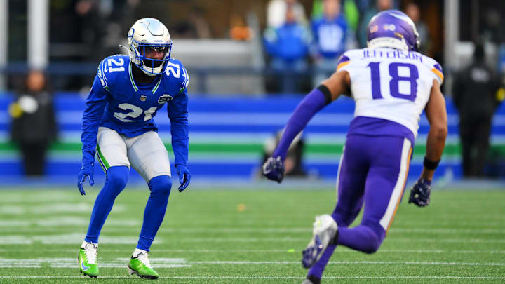 Nov 30, 2025; Seattle, Washington, USA; Seattle Seahawks cornerback Devon Witherspoon (21) prepares for the play against Minnesota Vikings wide receiver Justin Jefferson (18) during the second half at Lumen Field.