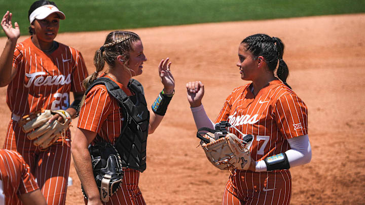 Texas Longhorns catcher Reese Atwood (14) greets pitcher Citlaly Gutierrez (77) after striking out a Texas A&M batter during the NCAA Regional game at Red & Charline McCombs Field on Saturday, May 20, 2023 in Austin. Texas Longhorns catcher Reese Atwood (14) greets pitcher Citlaly Gutierrez (77) after striking out a Texas A&M batter during the NCAA Regional game at Red & Charline McCombs Field on Saturday, May 20, 2023 in Austin.