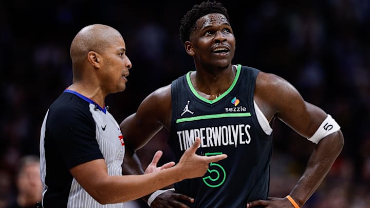 Apr 1, 2025; Denver, Colorado, USA; Minnesota Timberwolves guard Anthony Edwards (5) talks with referee CJ Washington (12) in overtime against the Denver Nuggets at Ball Arena. Apr 1, 2025; Denver, Colorado, USA; Minnesota Timberwolves guard Anthony Edwards (5) talks with referee CJ Washington (12) in overtime against the Denver Nuggets at Ball Arena.