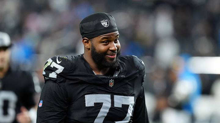 Dec 14, 2023; Paradise, Nevada, USA;  Las Vegas Raiders offensive tackle Thayer Munford Jr. (77) smiles after the game against the Los Angeles Chargers at Allegiant Stadium. Mandatory Credit: Stephen R. Sylvanie-Imagn Images