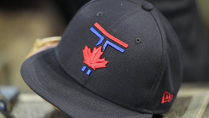 Jul 18, 2025; Toronto, Ontario, CAN; A Toronto Blue Jays ball cap sit in the dug out during the eighth inning against the San Francisco Giants at Rogers Centre. 