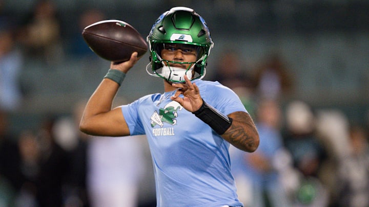 Nov 28, 2024; New Orleans, Louisiana, USA; Tulane Green Wave quarterback Ty Thompson (7) throws before a game against the Memphis Tigers at Yulman Stadium. Nov 28, 2024; New Orleans, Louisiana, USA; Tulane Green Wave quarterback Ty Thompson (7) throws before a game against the Memphis Tigers at Yulman Stadium.