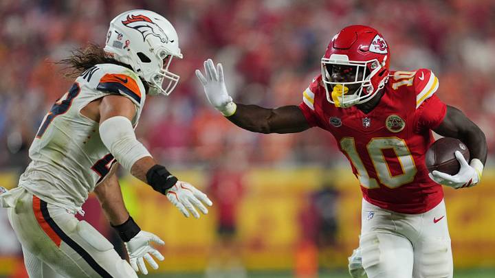 Sep 14, 2026; Kansas City, Missouri, USA; Kansas City Chiefs running back Emmett Johnson (10) rushes the ball against Denver Broncos linebacker Alex Singleton (49) at GEHA Field at Arrowhead Stadium. Mandatory Credit: Jay Biggerstaff-Imagn Images Sep 14, 2026; Kansas City, Missouri, USA; Kansas City Chiefs running back Emmett Johnson (10) rushes the ball against Denver Broncos linebacker Alex Singleton (49) at GEHA Field at Arrowhead Stadium. Mandatory Credit: Jay Biggerstaff-Imagn Images