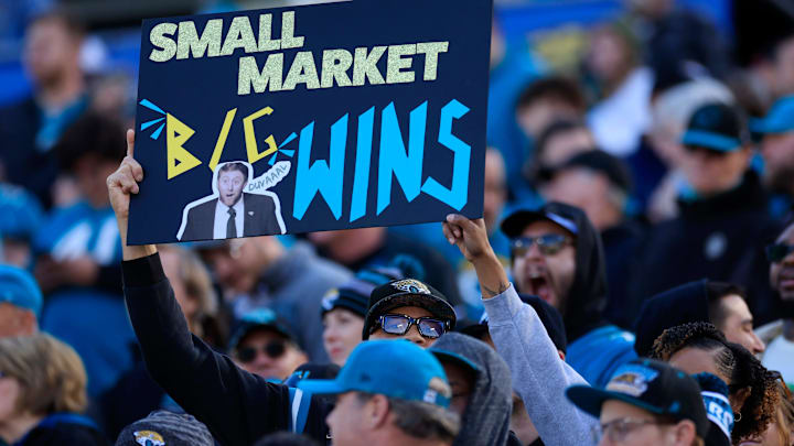 A Jacksonville Jaguars fan holds up a sign during the second quarter of an NFL football matchup at EverBank Stadium, Sunday, Jan. 4, 2026, in Jacksonville, Fla. The Jaguars defeated the Titans 41-7, capturing the AFC South title. 